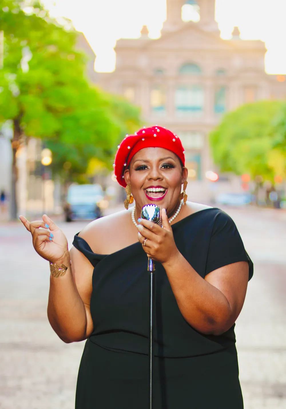Audra Scott singing outdoors in downtown Fort Worth